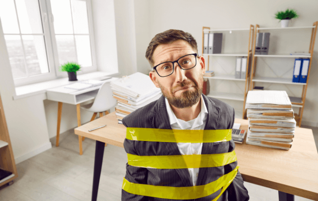 A man tied up in an office