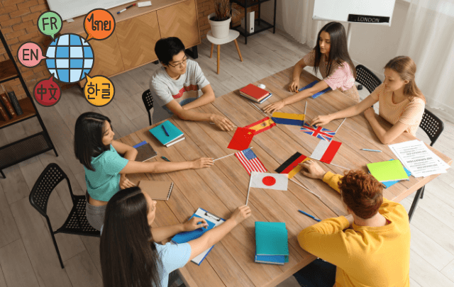 a group of students sitting and holding different country flags