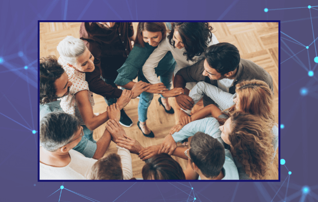 A group of people joining hands to one another showing team work and connection
